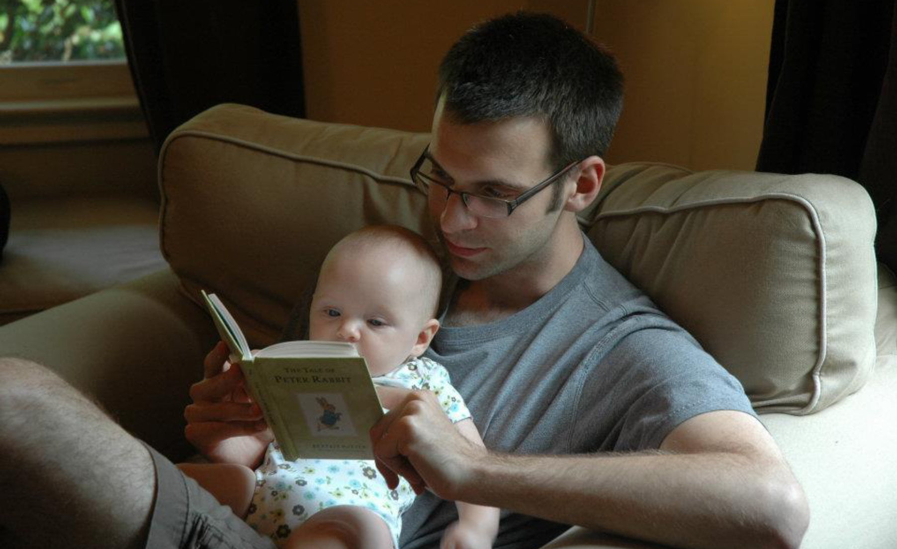 Father reading to baby