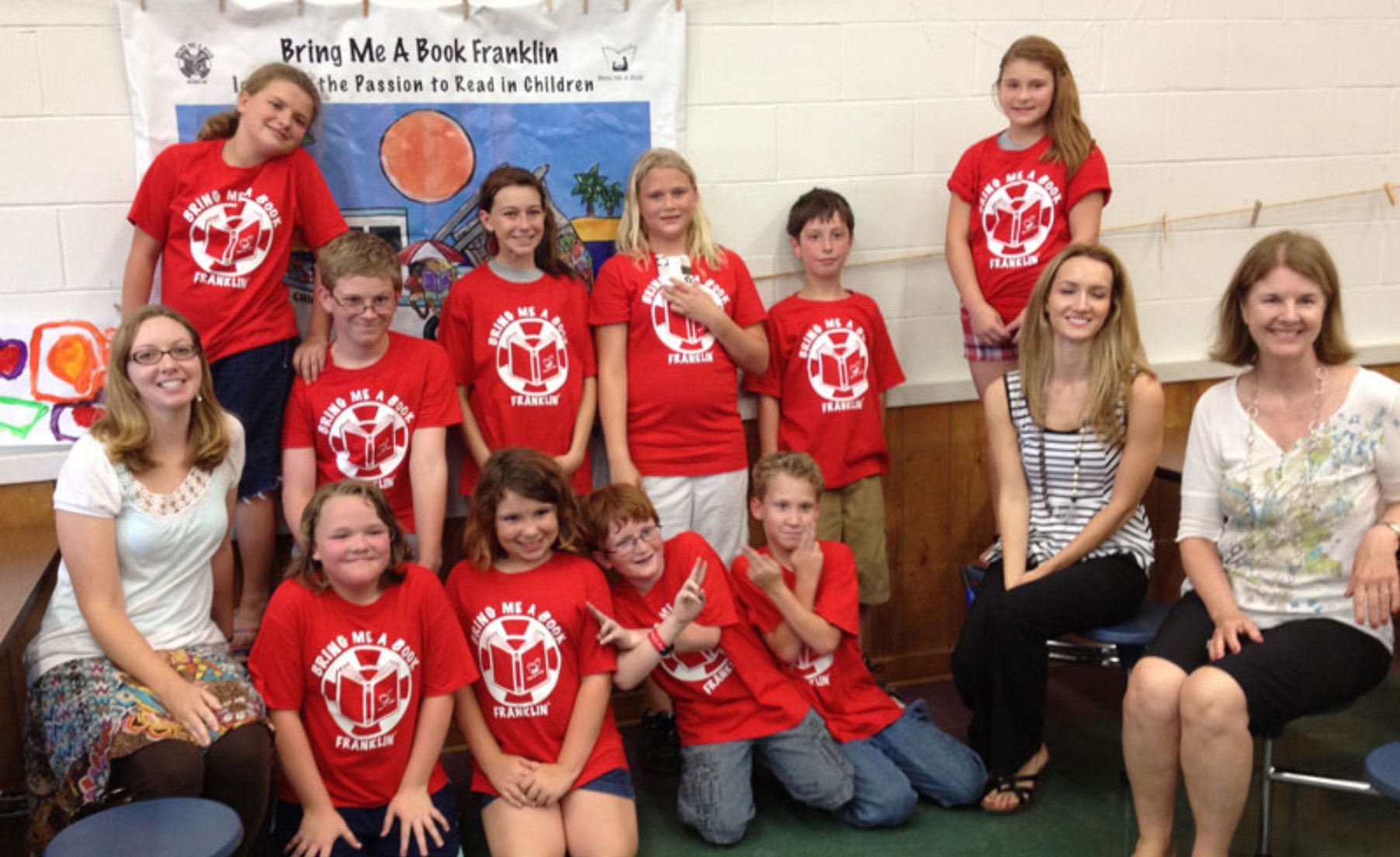 Group of kids with adult readers from BMAB