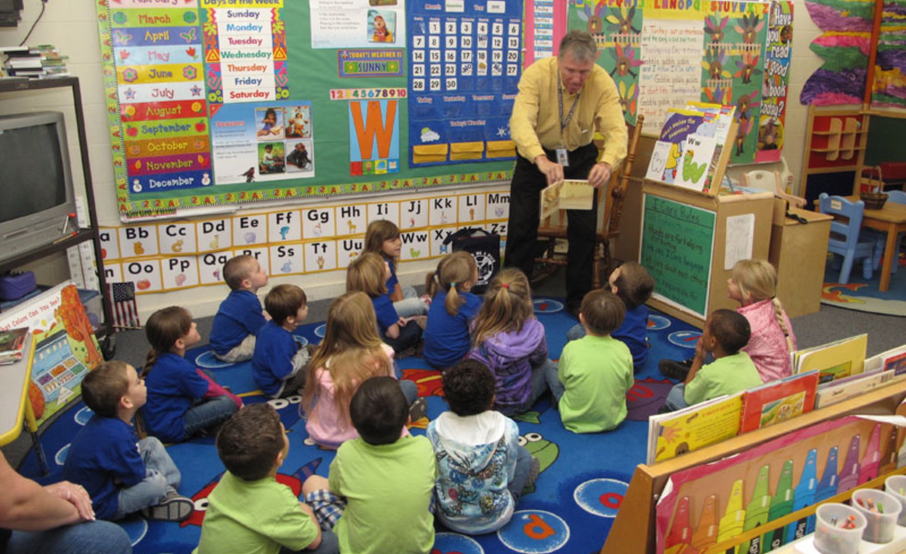 Man reading to a class