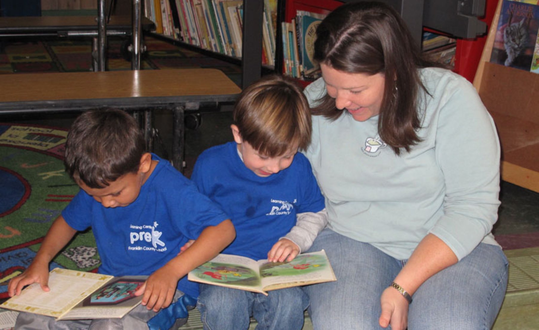 Mother reading with children