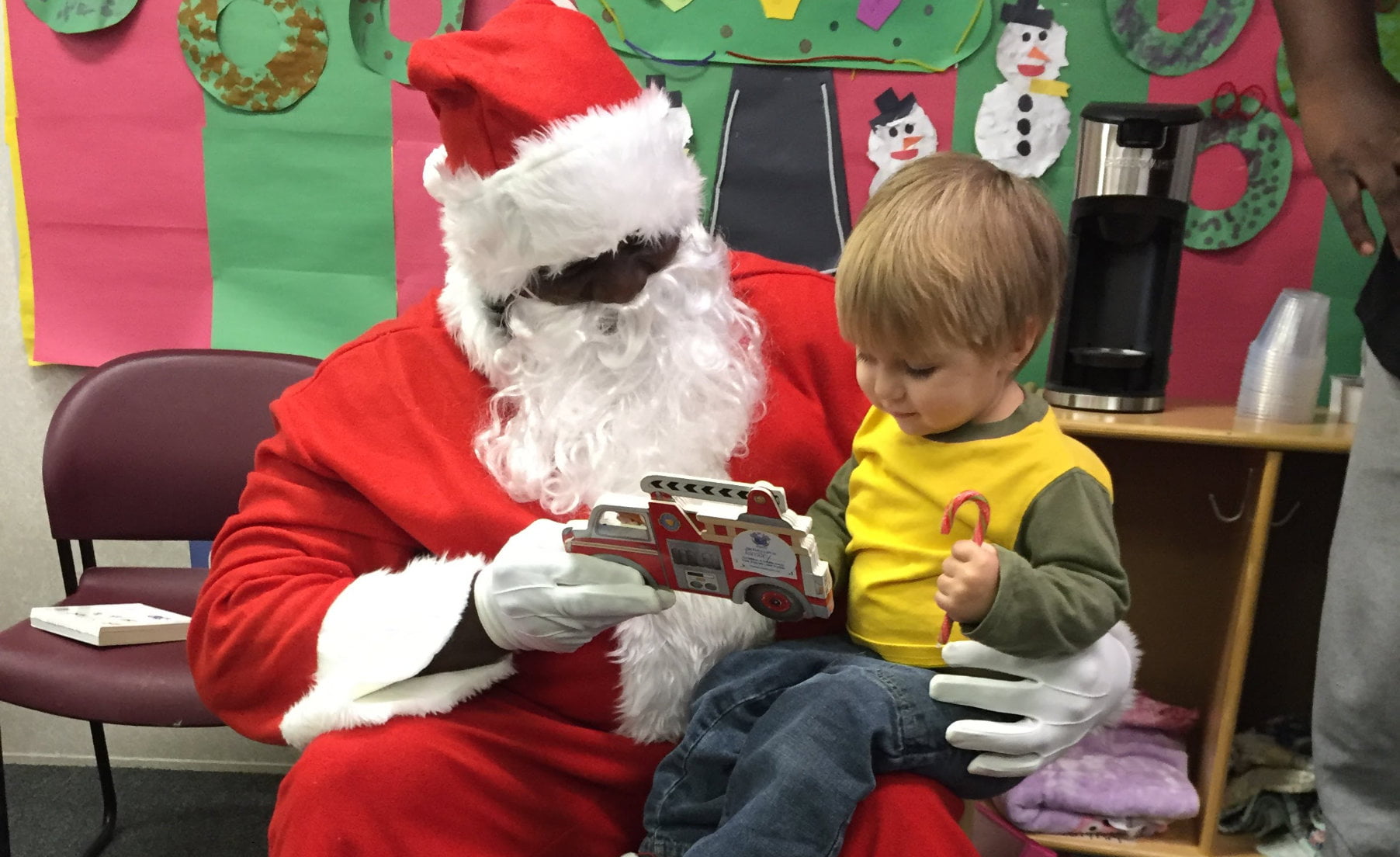 Early headstart child sitting on Santa's lap