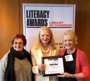 Three women accepting an award